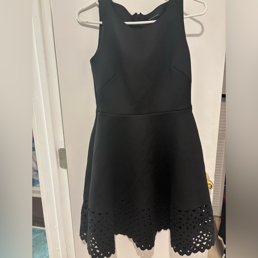 WHBM black dress with pretty design at the bottom.